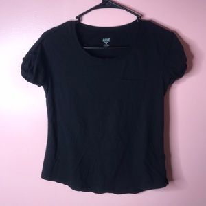 Black t-shirt with front pocket.